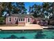 Inviting backyard featuring a sparkling pool and relaxing deck area at 1830 Virginia Dr, Bradenton, FL 34205