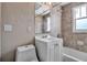 Cozy bathroom featuring a shower/tub combo and tiled walls at 1830 Virginia Dr, Bradenton, FL 34205