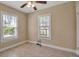 Cozy bedroom with tan walls and two windows at 1830 Virginia Dr, Bradenton, FL 34205