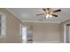 Large living room featuring tile floors, natural lighting, and white trim detailing around the ceiling at 1830 Virginia Dr, Bradenton, FL 34205