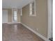 Neutral room with tile floors, white trim, and natural light at 1830 Virginia Dr, Bradenton, FL 34205