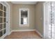 Mud room with tile flooring features a window and exterior access on both sides of the room at 1830 Virginia Dr, Bradenton, FL 34205