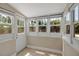 Charming sunroom with multiple windows offering abundant natural light at 1830 Virginia Dr, Bradenton, FL 34205
