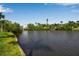 Scenic water view with lush greenery along the shoreline offers a serene and picturesque setting at 1830 Virginia Dr, Bradenton, FL 34205