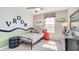 Themed bedroom features a race car bed, fun decor, and plenty of natural light at 18305 Fattoria Ter, Lakewood Ranch, FL 34211