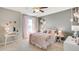 Bedroom boasts soft pink decor, a decorative headboard, and natural lighting at 18305 Fattoria Ter, Lakewood Ranch, FL 34211