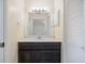 Bathroom with a modern vanity, white countertop, and large mirror above the sink at 1856 Wharf Rd, Sarasota, FL 34231