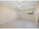 Spacious bedroom featuring a ceiling fan and tile flooring throughout the space at 1856 Wharf Rd, Sarasota, FL 34231