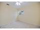 Simple, clean bedroom with a ceiling fan and window; perfect for relaxation at 1856 Wharf Rd, Sarasota, FL 34231