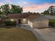 Charming single-story home with a well-maintained lawn, two-car garage, and a welcoming red front door at 1856 Wharf Rd, Sarasota, FL 34231