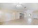 Spacious living room featuring tile flooring, ceiling fans, and ample natural light at 1856 Wharf Rd, Sarasota, FL 34231