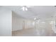 Bright and airy living room with tile flooring, ceiling fans, and fresh, neutral paint at 1856 Wharf Rd, Sarasota, FL 34231