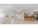 Open living space showcasing tile floors, a kitchen bar, and a bright, airy atmosphere at 1856 Wharf Rd, Sarasota, FL 34231