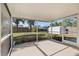 Screened-in porch overlooking a fenced backyard, perfect for enjoying the outdoors at 1856 Wharf Rd, Sarasota, FL 34231