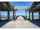 The Anna Maria City Pier entrance with classic grill and bait shop signage at 212 72Nd, Holmes Beach, FL 34217