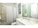 Bright bathroom with tub and shower, large mirror and white marble vanity at 212 72Nd, Holmes Beach, FL 34217