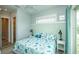 Bright bedroom featuring a turtle themed bed set, and two windows for great light at 212 72Nd, Holmes Beach, FL 34217
