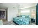 Bright bedroom featuring coastal decor, wood floors, and natural light at 212 72Nd, Holmes Beach, FL 34217