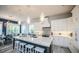 Gourmet kitchen with center island, breakfast bar, stainless appliances, and stylish pendant lighting at 212 72Nd, Holmes Beach, FL 34217