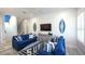 Nautical themed living room with comfortable seating, ship lap accent wall, and beach decor at 212 72Nd, Holmes Beach, FL 34217