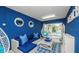 Bright, beachy living room with comfortable furniture, white wicker chairs, and access to outdoor area at 212 72Nd, Holmes Beach, FL 34217