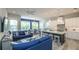 Open-concept kitchen, living, and dining area with a stylish design and beach-inspired decor at 212 72Nd, Holmes Beach, FL 34217