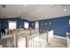 Spacious loft area with seating, light wood floors, large windows, and nautical themed decor at 212 72Nd, Holmes Beach, FL 34217