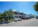 Multi-level waterfront restaurant with ample parking and tropical landscaping at 212 72Nd, Holmes Beach, FL 34217
