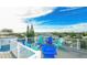 A roof deck featuring colorful Adirondack chairs and open views of the neighborhood at 212 72Nd, Holmes Beach, FL 34217