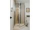 Modern bathroom features a glass-enclosed shower stall with designer fixtures and tiled walls at 2300 Stratford Dr, Sarasota, FL 34232