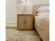 Bedroom featuring a modern nightstand with cabinets, lamp, and a comfortable bed at 2300 Stratford Dr, Sarasota, FL 34232