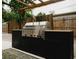Premium outdoor grill with stainless steel accents set in a modern outdoor kitchen at 2300 Stratford Dr, Sarasota, FL 34232