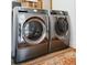 Modern laundry room with high-end washer and dryer sets at 2300 Stratford Dr, Sarasota, FL 34232