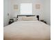 Bedroom showcases a comfortable bed with tasteful decor, creating a relaxing and inviting retreat at 2300 Stratford Dr, Sarasota, FL 34232