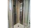 Modern shower features a sleek, multi-jet panel and stylish tile work at 2300 Stratford Dr, Sarasota, FL 34232