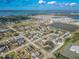 Aerial shot displaying a neighborhood next to a body of water near a town, showcasing a tranquil living environment at 2402 16Th W St, Palmetto, FL 34221