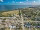 An aerial view of a bay community with some houses and a waterfront landscape on a sunny day at 2402 16Th W St, Palmetto, FL 34221