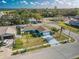 Elevated view showcases a home with a well-kept lawn, established trees, and a tranquil residential setting at 2402 16Th W St, Palmetto, FL 34221