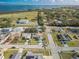 A sprawling neighborhood is showcased in an aerial view, with homes nestled among lush greenery and scenic waterfront views at 2402 16Th W St, Palmetto, FL 34221