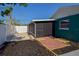 Backyard with a screened in porch and mix of brick, mulch and gravel groundcover at 2402 16Th W St, Palmetto, FL 34221