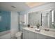 The bathroom is well-lit and features a tub and shower combination and double sink vanity with storage at 2402 16Th W St, Palmetto, FL 34221