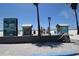 Beach entrance with informational signage and small blue-painted cabanas for changing and storage at 2402 16Th W St, Palmetto, FL 34221