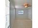 This empty bedroom has ceramic tile and a window at 2402 16Th W St, Palmetto, FL 34221