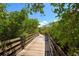 Beautiful boardwalk surrounded by native trees and lush greenery at 2402 16Th W St, Palmetto, FL 34221
