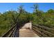 Peaceful wooded boardwalk path with protective railing at 2402 16Th W St, Palmetto, FL 34221