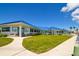 Elegant clubhouse with manicured lawn and inviting entrance for community members at 2402 16Th W St, Palmetto, FL 34221