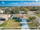 Charming single-story home with a well-manicured lawn, mature trees, and inviting curb appeal at 2402 16Th W St, Palmetto, FL 34221