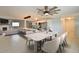 Open-concept dining and kitchen area with a marble table, seating, and modern appliances at 2402 16Th W St, Palmetto, FL 34221