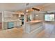 Updated kitchen with stainless steel appliances, a breakfast bar, and access to the dining area at 2402 16Th W St, Palmetto, FL 34221