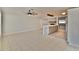 Spacious open-plan living and kitchen area with tiled floors and modern decor at 2402 16Th W St, Palmetto, FL 34221